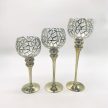 Arany színű, üvegből készült háromrészes gyertyatartó szett texturált, geometrikus mintával dís